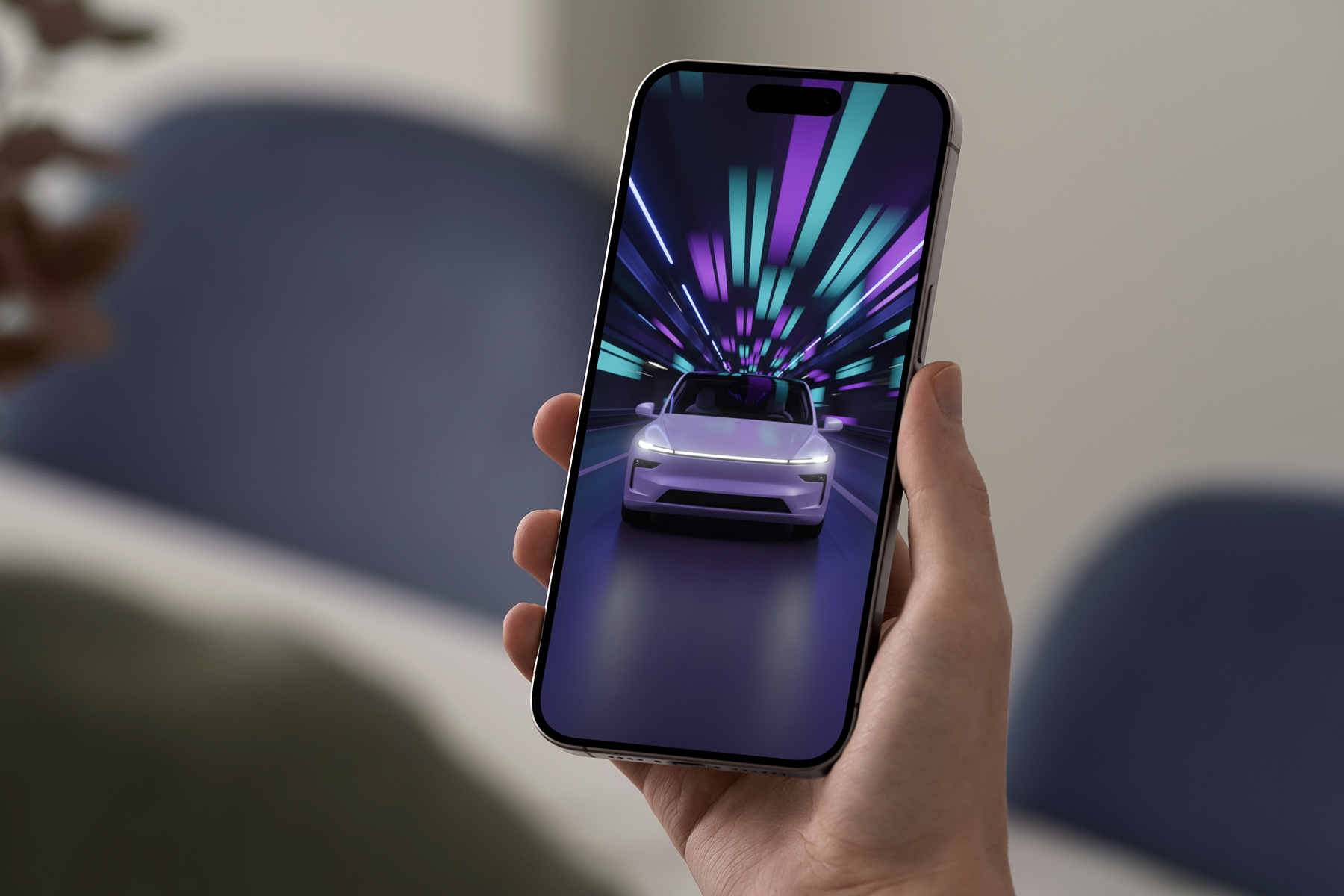 Hand holding an iPhone 15 Pro showing a Tesla Model Y Juniper wallpaper with neon tunnel lights in purple, blue, and green.